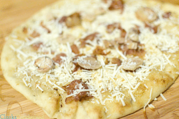 Mizithra Pizza {{inspired by Old Spaghetti Factory}} made with mushrooms, bacon, mizithra, and a garlic butter sauce