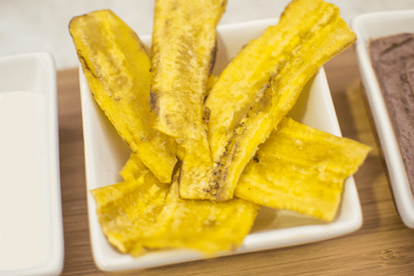 Fried Plantains with creamy black beans and Mexicana Crema