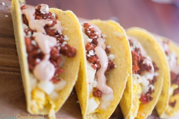 Spicy Breakfast Tacos: Filling and perfect for breakfast, these spicy breakfast tacos are filled with scrambled eggs, chorizo, potatoes o'brien, and a creamy sauce on top.