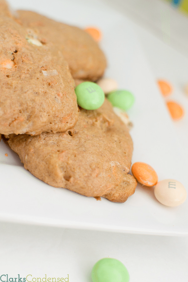 Carrot Cake Cookie Recipe: These cookies are simple, soft, and delicious! Made with a cake mix, these carrot cake cookies just very cake-like because of pineapple, and the added addition of carrot cake M&Ms (or white chocolate chips) help make them melt in your mouth!