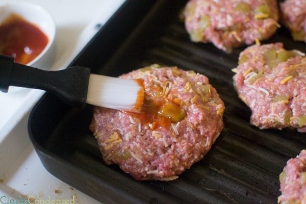 A twist on the traditional cheeseburger - this spicy cheesburger has the cheese on the inside, along with spicy BBQ sauce, green chiles, and more. Perfect for those hot summer nights!