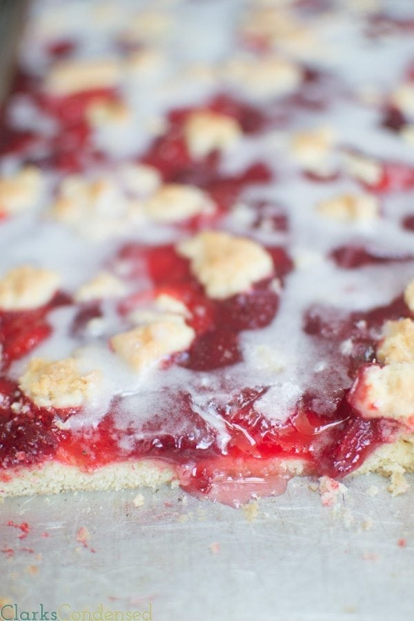 Strawberry Lemon Crumb Bars: A perfect way to kick off the spring and summer seasons. These bars have a naturally lemon flavored shortbread cookie crust, and are topped with sweet strawberry pie filling, and a lemony drizzle. 
