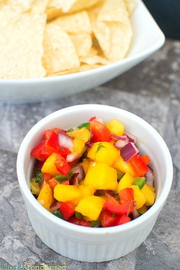 I am totally obsessed with this honey lime, mango salsa! It is SO good -- perfect combination of sweet and spicy, tastes great on chips, fish, or chicken, and PERFECT for summer parties