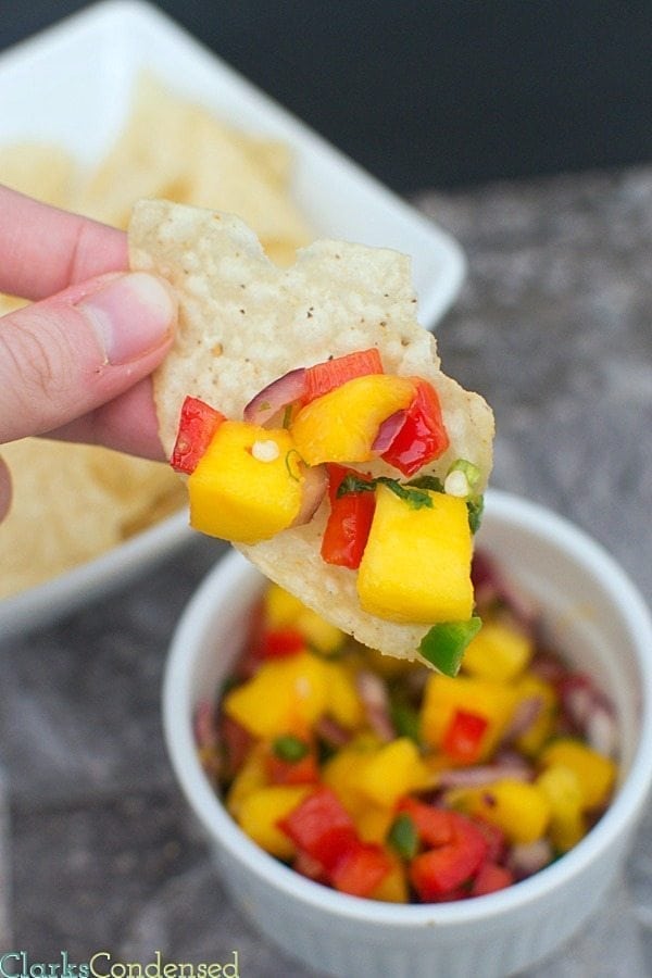 I am totally obsessed with this honey lime, mango salsa! It is SO good -- perfect combination of sweet and spicy, tastes great on chips, fish, or chicken, and PERFECT for summer parties