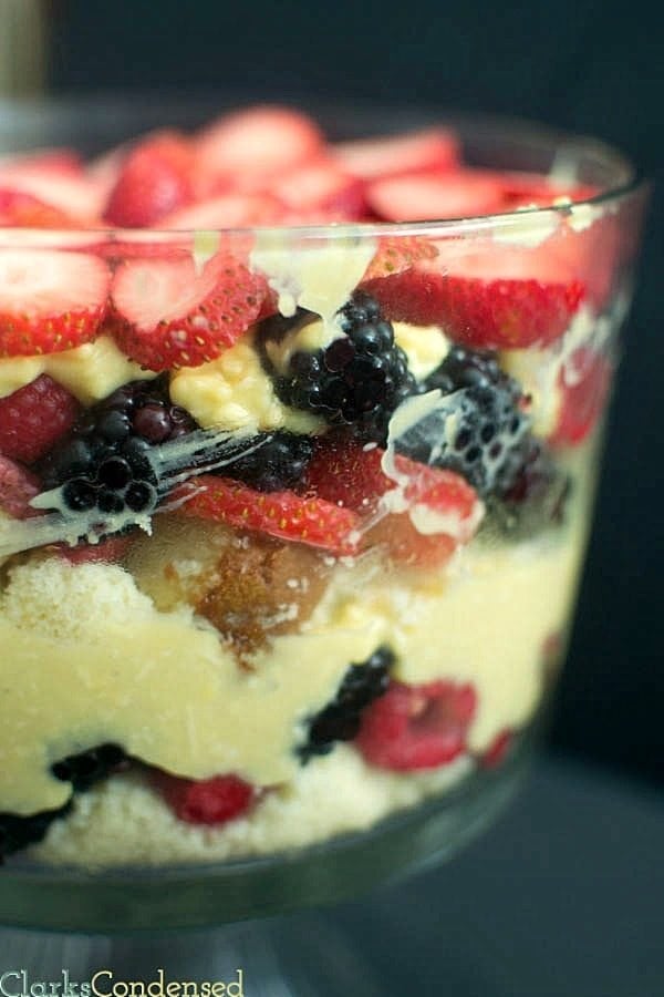 This triple berry trifle is light and perfect for summer desserts. It has layers of raspberries, blackberries, and strawberries, along with pound cake and coconut pudding.