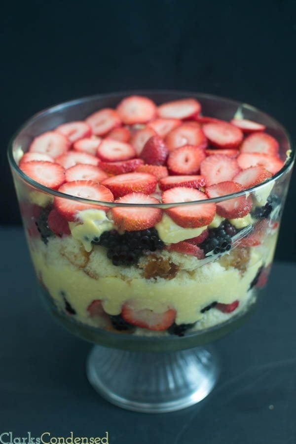 This triple berry trifle is light and perfect for summer desserts. It has layers of raspberries, blackberries, and strawberries, along with pound cake and coconut pudding.