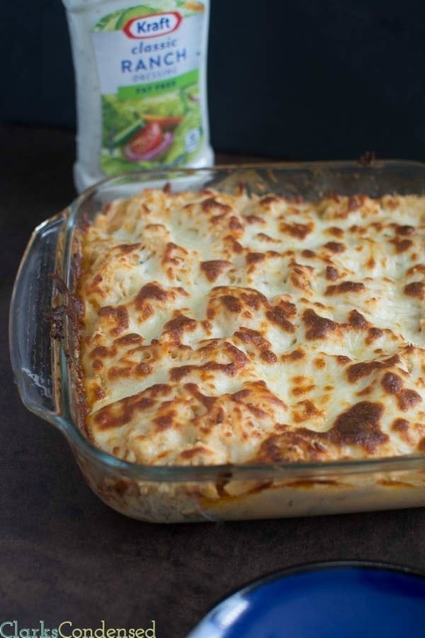 This potato and buffalo chicken casserole is super easy to throw together and absolutely delicious! It has potatoes, ranch dressing, bacon, onions, cheese, panko, and more!