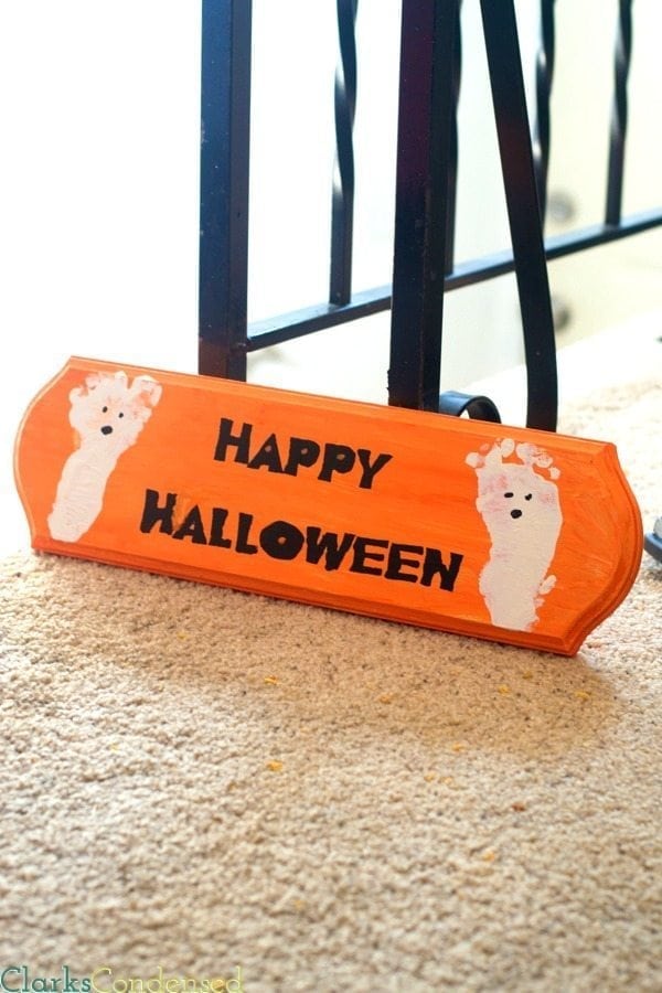 An easy Happy Halloween sign with ghost foot prints - stencil made using Silhouette