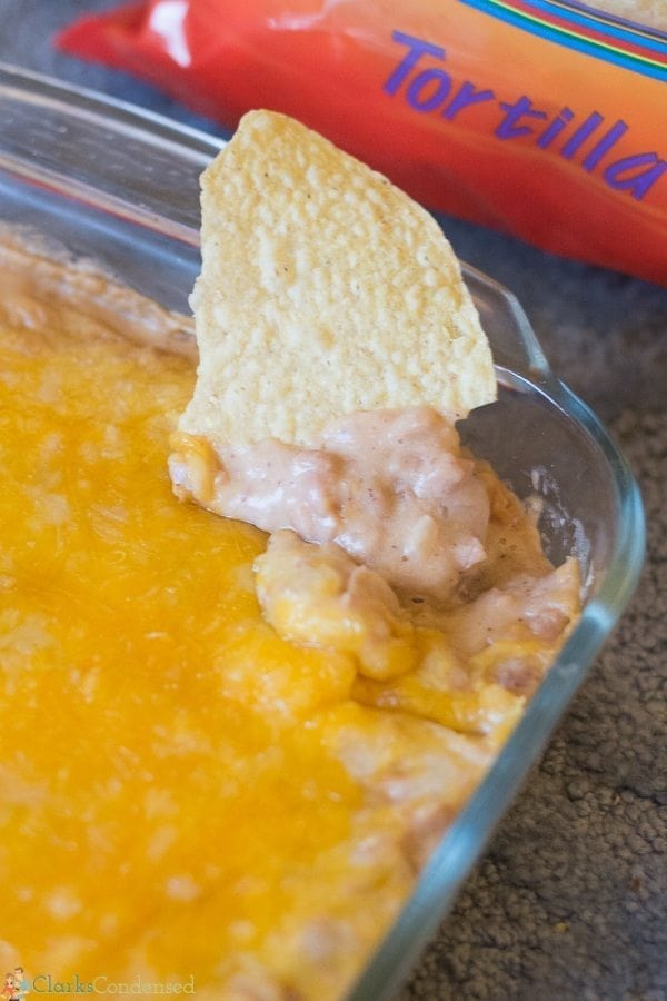 This easy cheesy refried bean dip is a a crowd-pleasing appetizer that will disappear quickly!