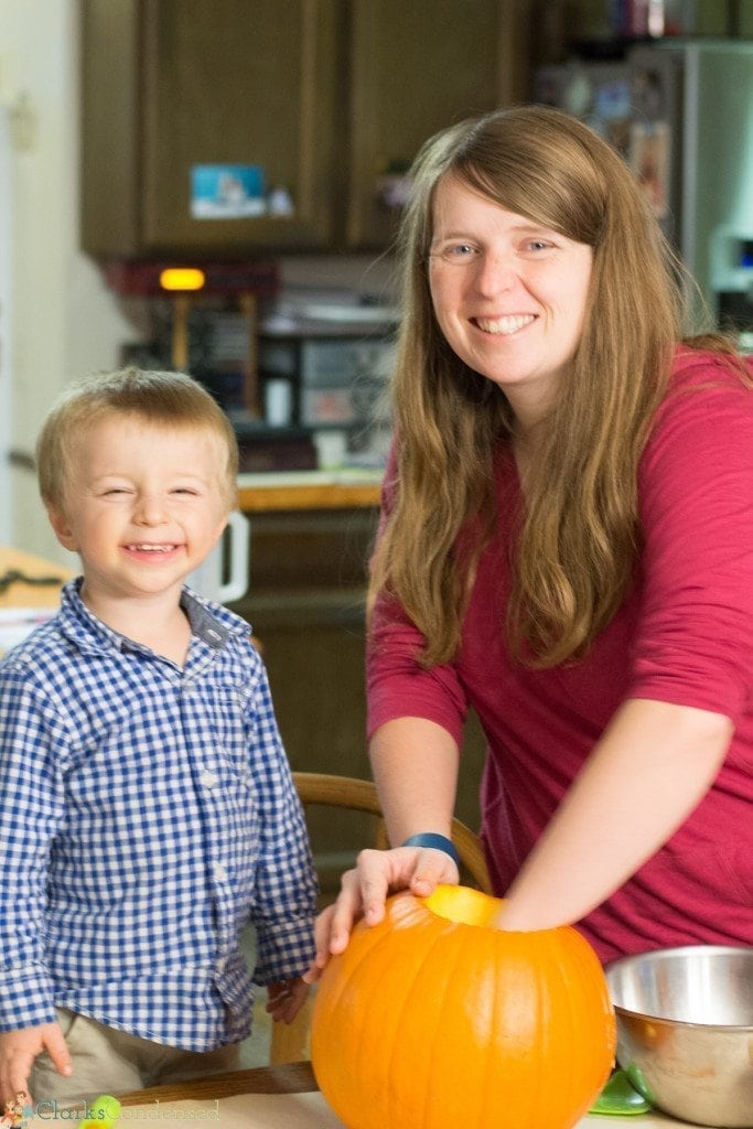 mother and son pumpkin carving