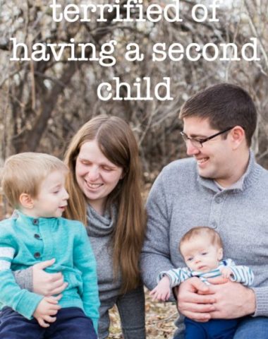 A group of people sitting in front of a baby