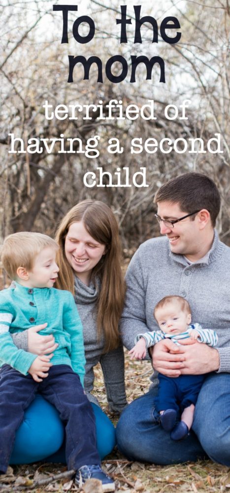 A group of people sitting in front of a baby