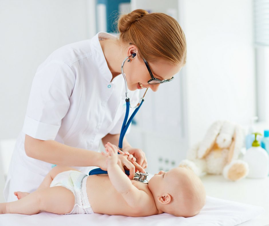 female pediatrician with baby