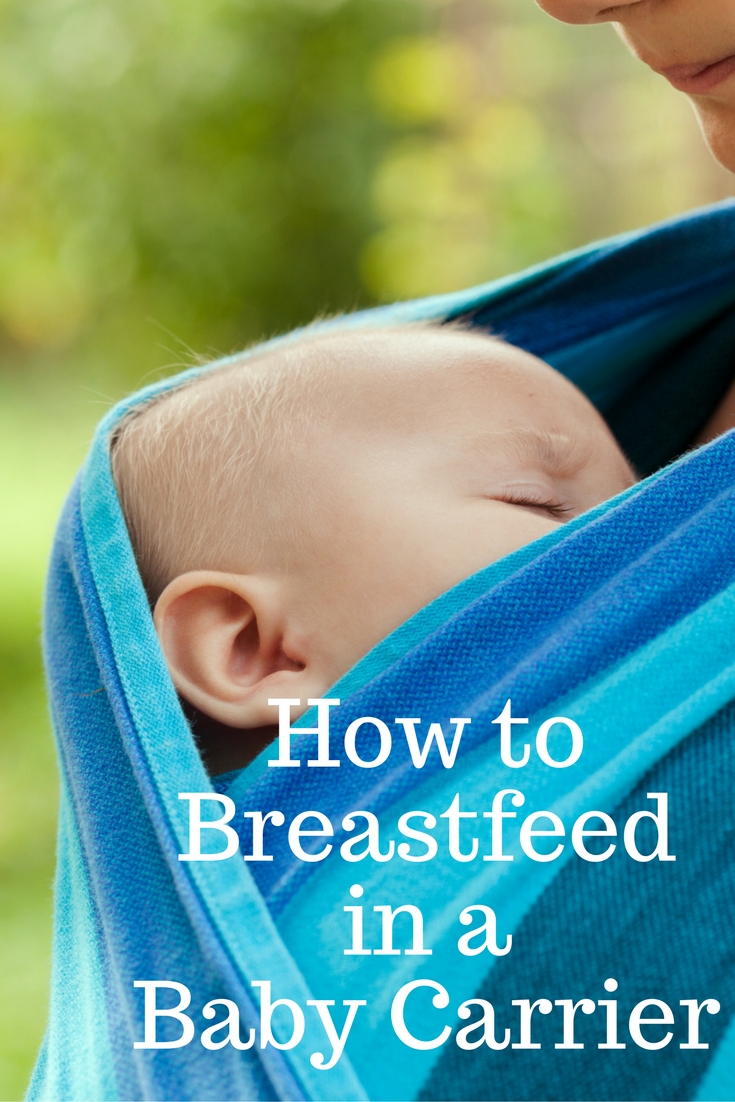 breastfeeding newborn in ergo baby carrier
