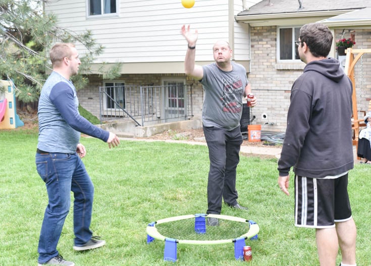 three men playing outdoor games for adults