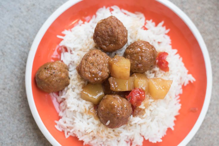 A plate of food, with Meatball