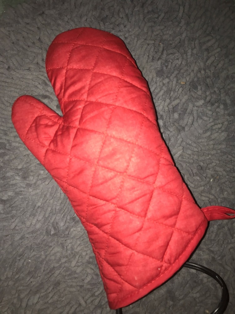 oven mitt with hair straightener in it