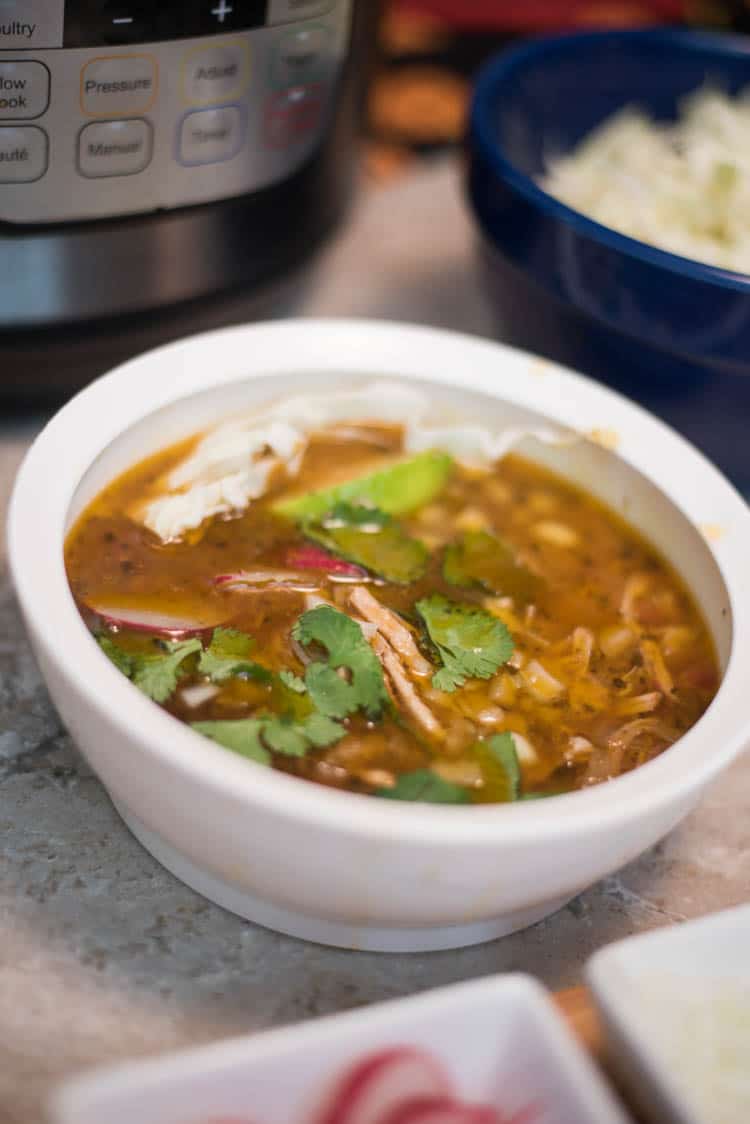 A close up of a bowl of food, with Pozole and Soup