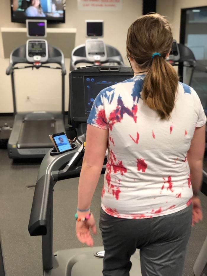 walking on treadmill at gym