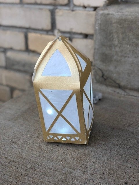 A DIY Paper Lantern in front of a brick building