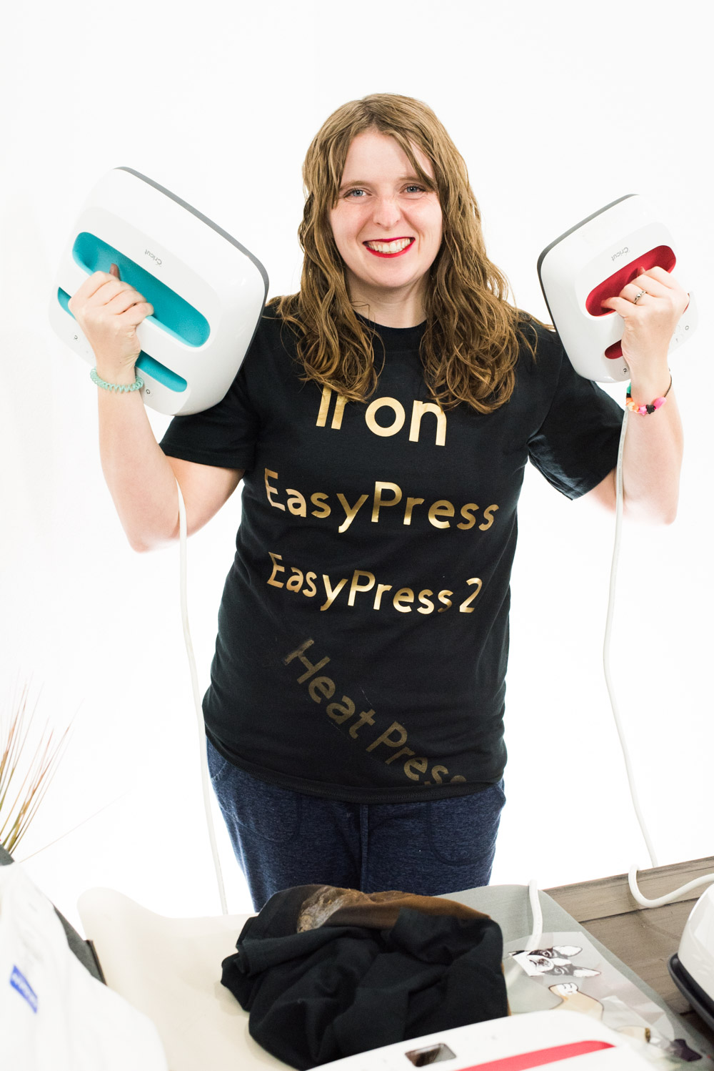 Katie standing with an original EasyPress and an EasyPress 2