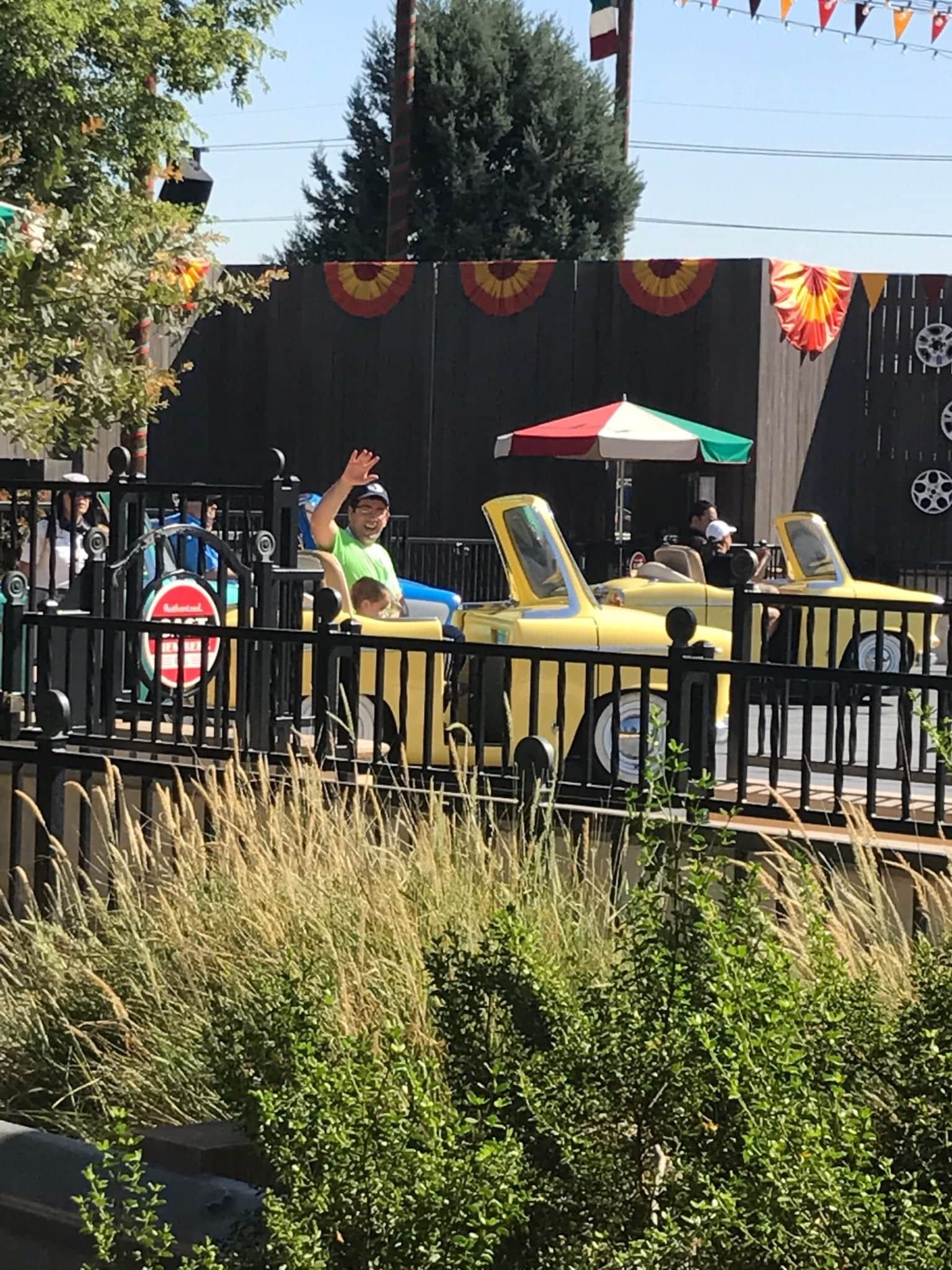 family waving on autotopia