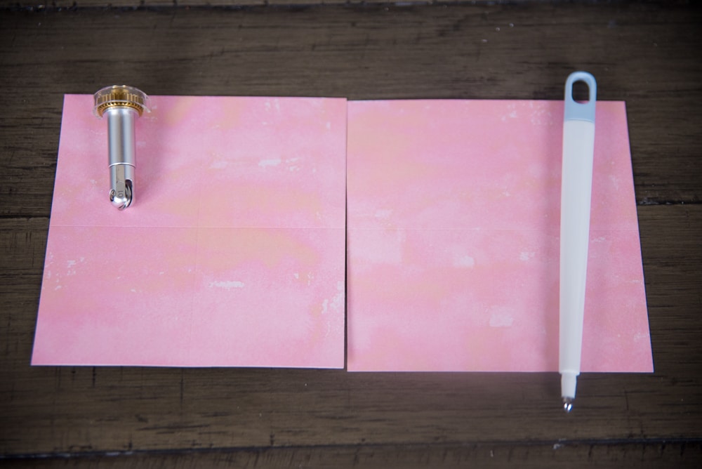 Closeup of a pink paper on table