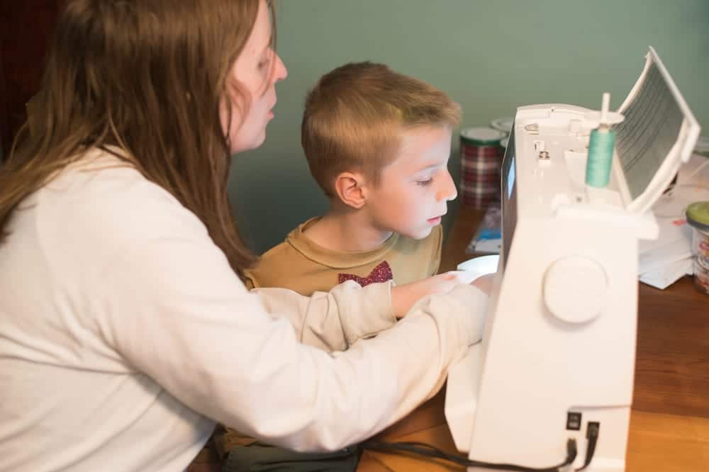 mom and son sewing