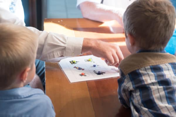 A young boy sitting at a table