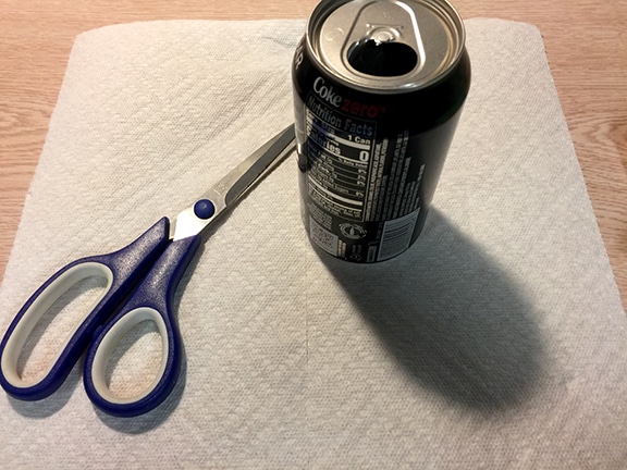 coke bottle with paper towel and scissors