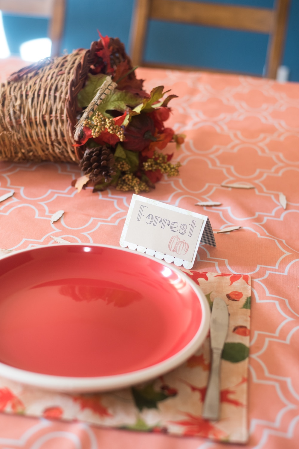 A table with a plate on in it and name card