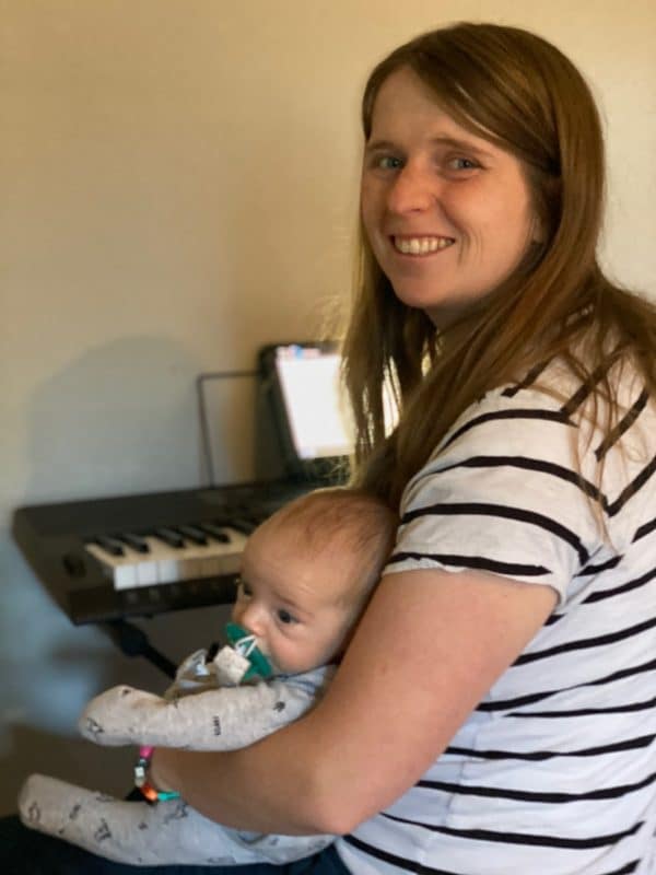 A woman holding a baby