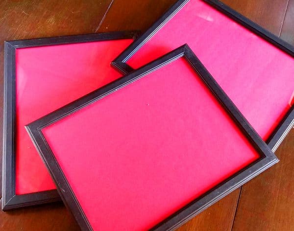 A close up of pink photo frames