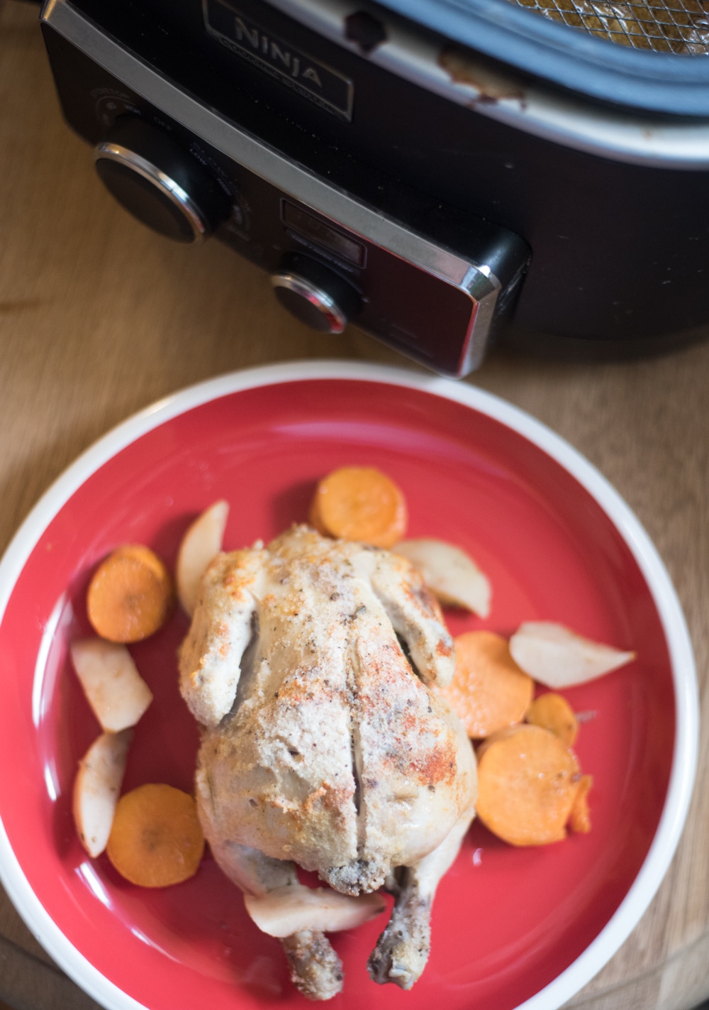 A plate of food on a table, with Slow cooker and Chicken