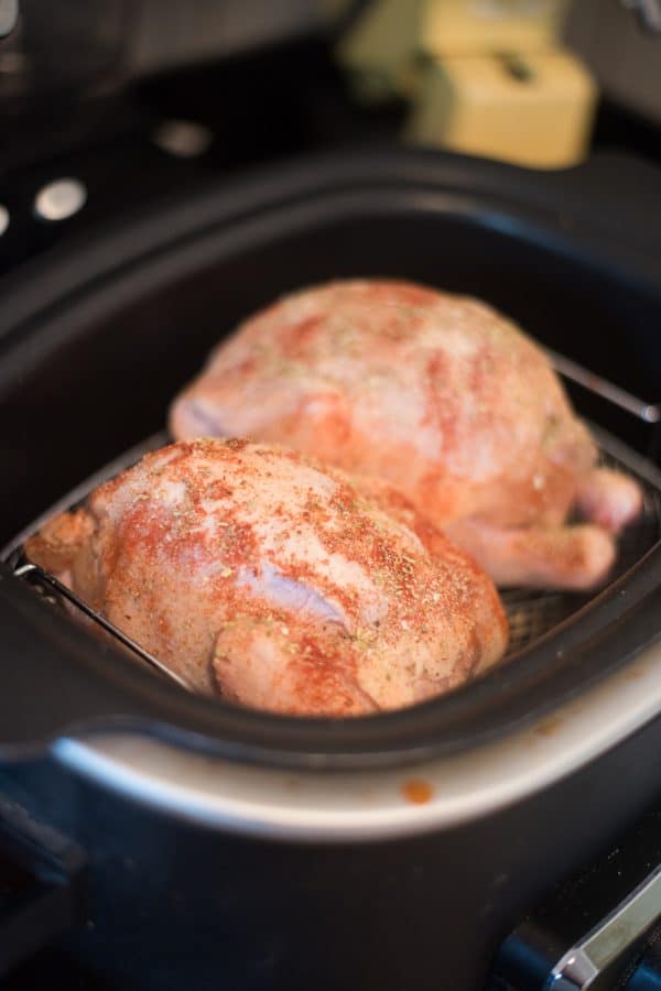 A close up of a pan on a stove, with Slow cooker and Chicken