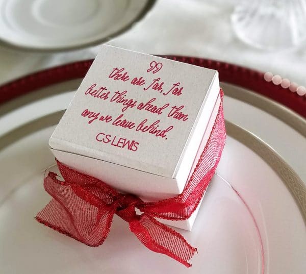 A close up of a cake on a plate, with Party favor