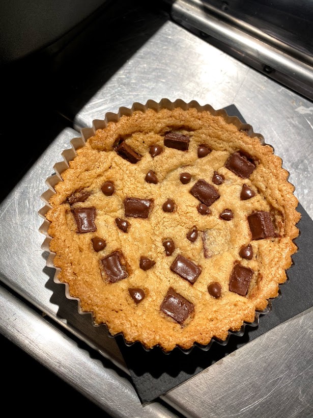 A close up of a chocochip cookie