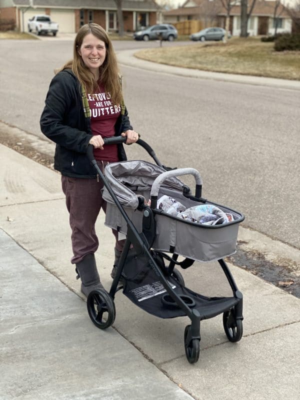 A woman walking with her baby