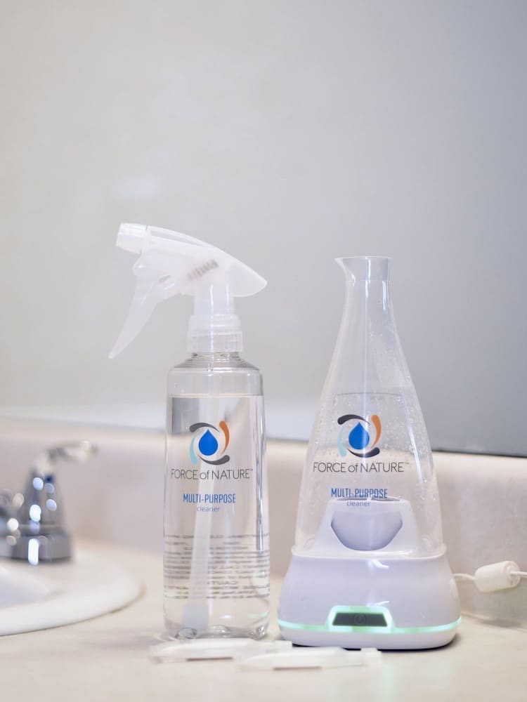 Spray bottle filled with water or some cleansing liquid