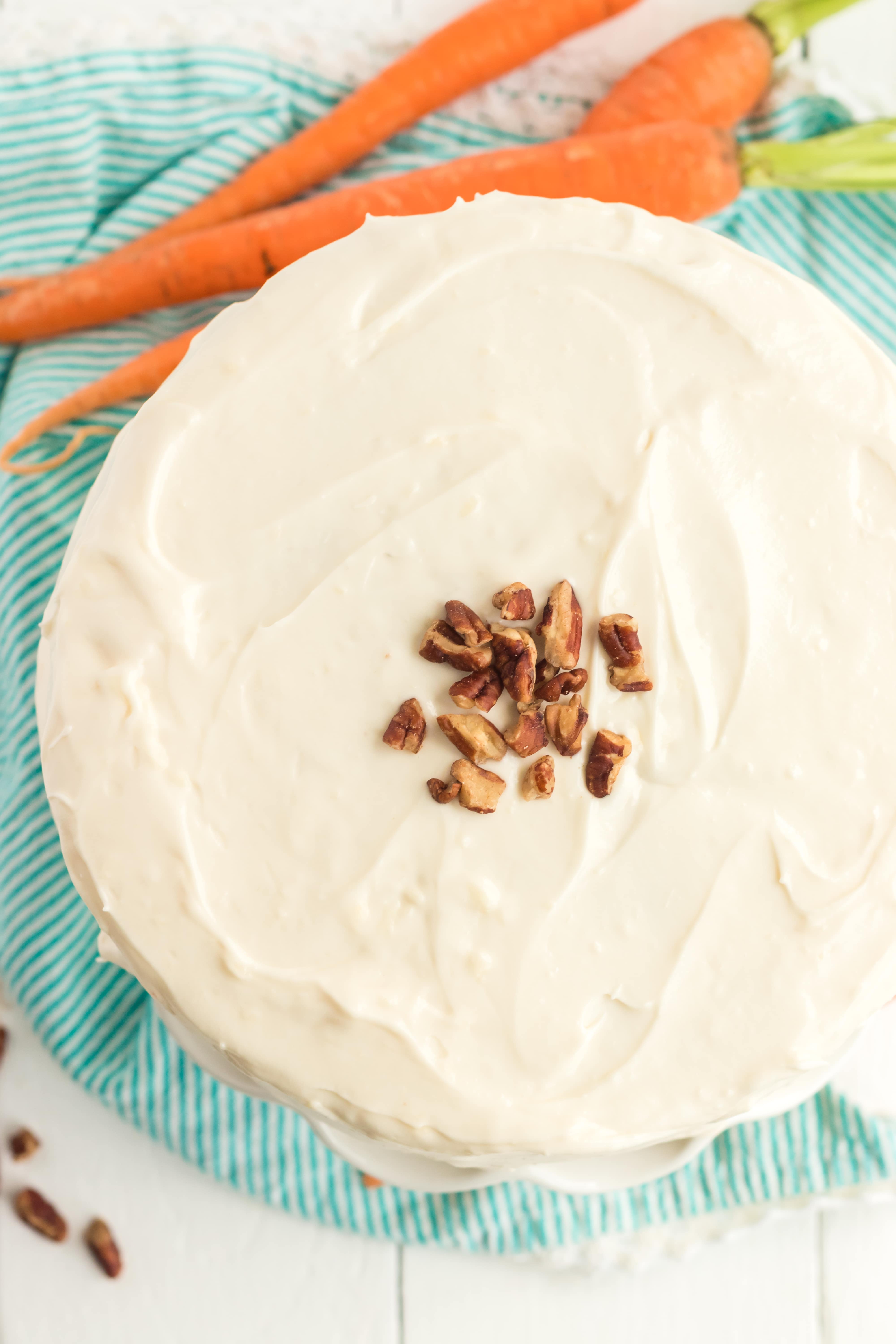 Carrot cake with icing and decorations on it