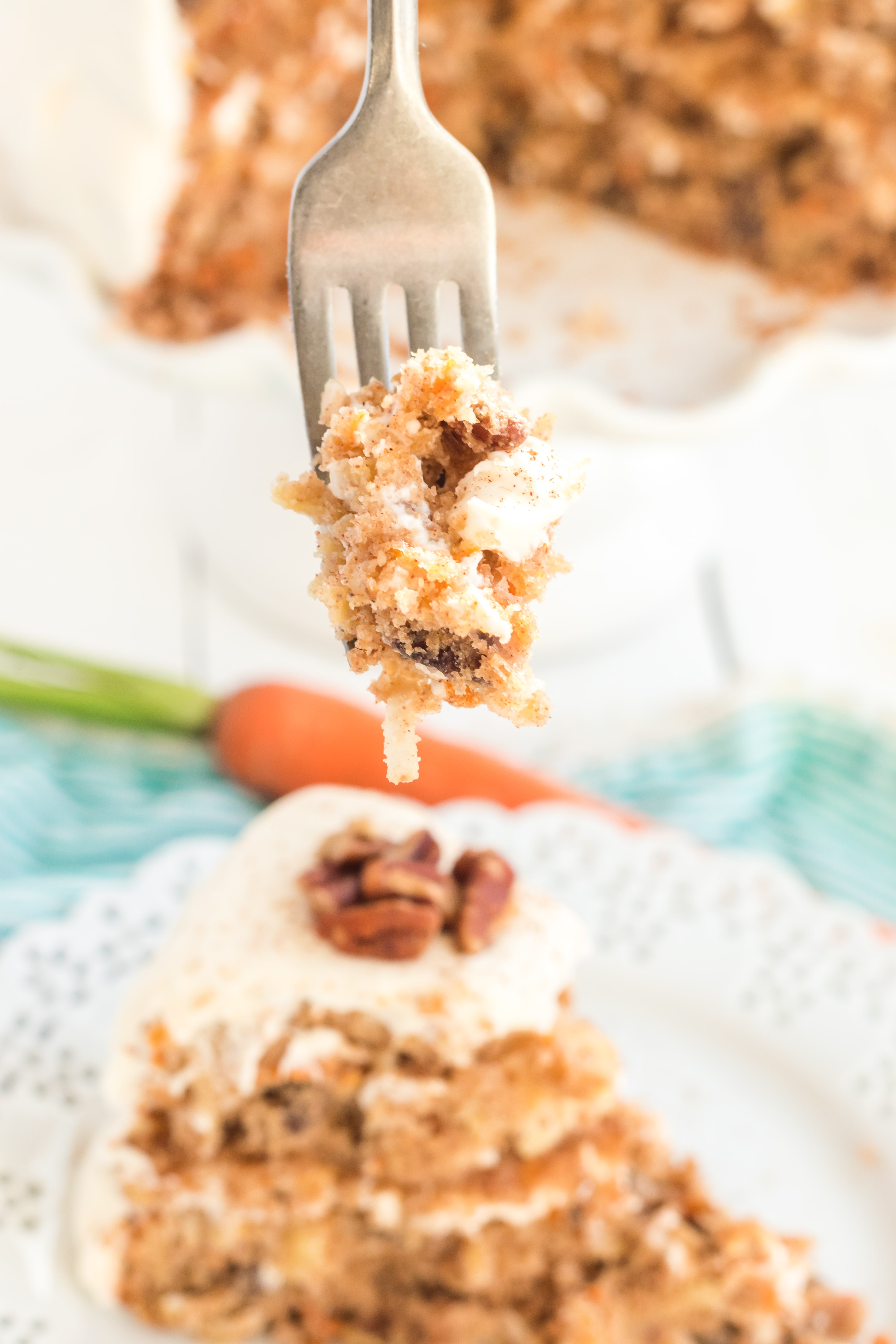 A piece of cake on a plate, with Carrot cake