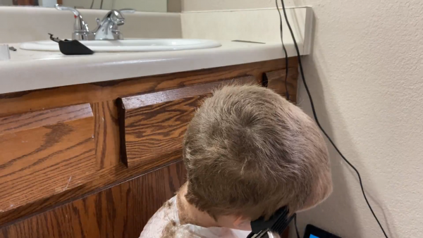 A man sitting in a sink