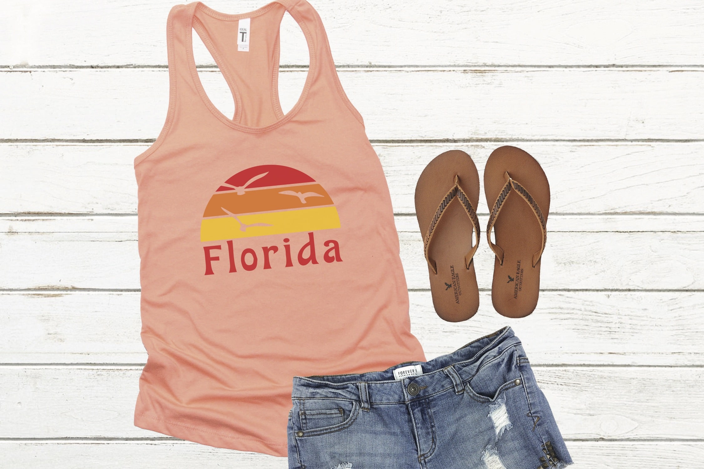 Pink tank top with Florida symbol with shorts and flip flops