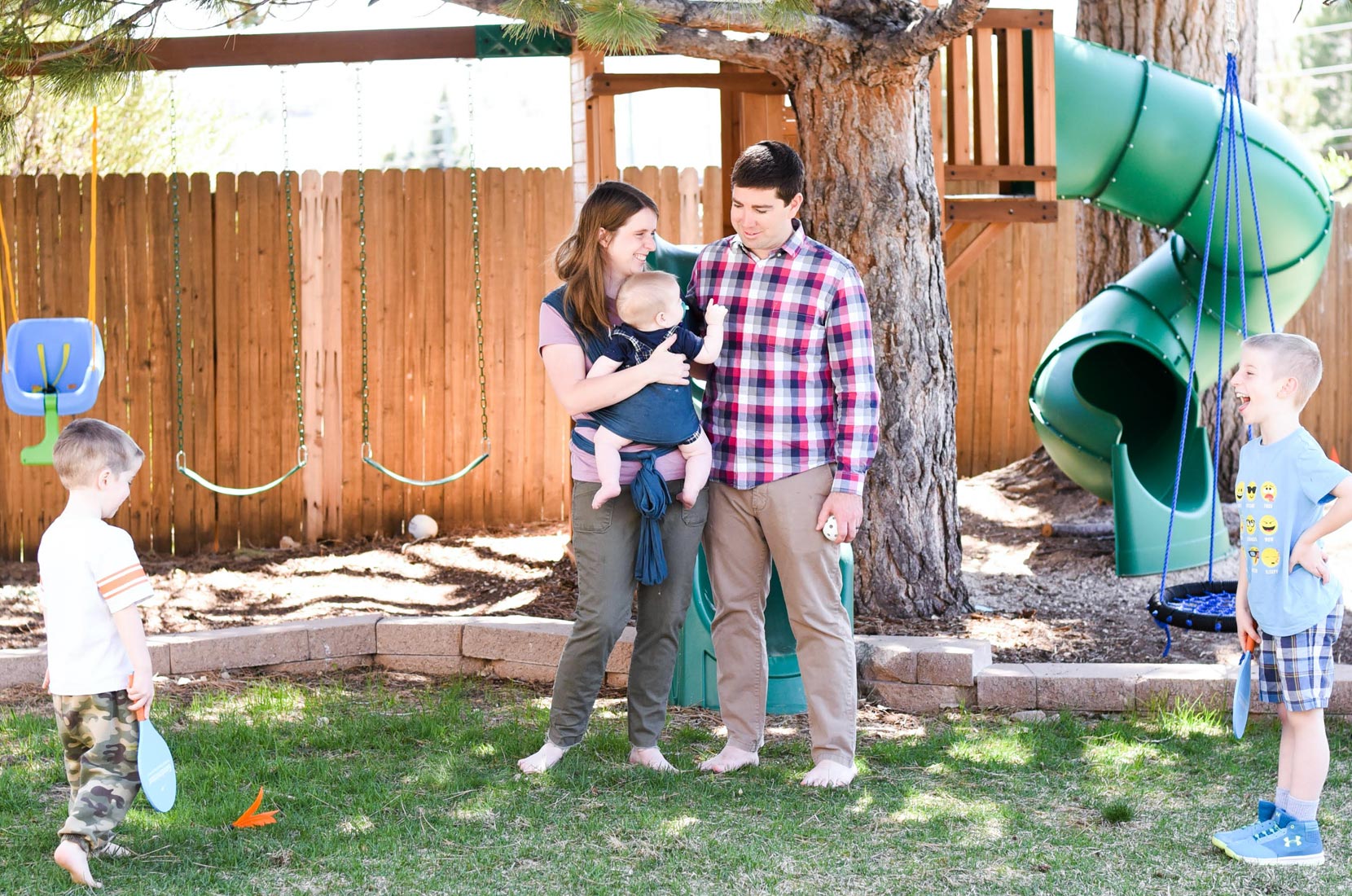 A group of people standing in a yard