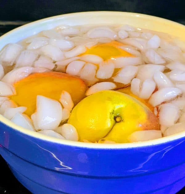 peaches in a bowl with ice