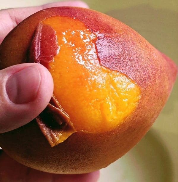 removing peel from the peach