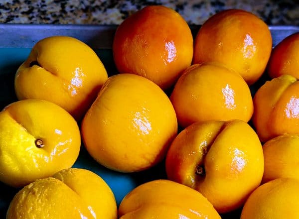 yellow peeled and washed peaches