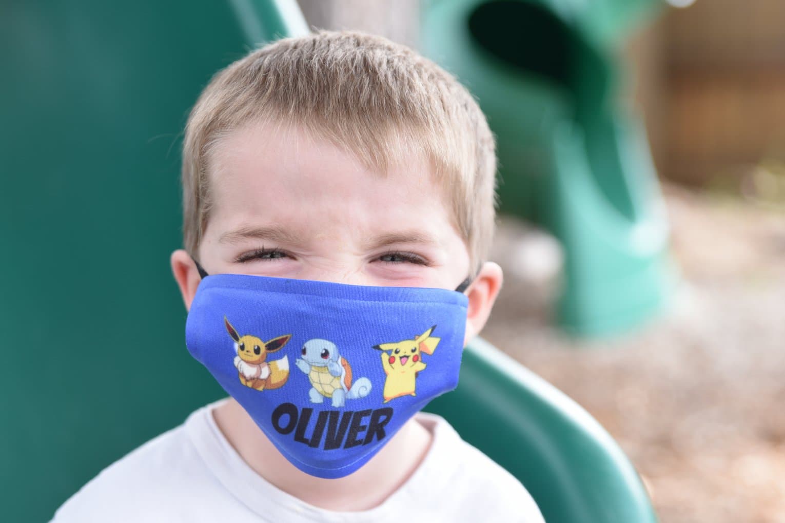 child with pokemon face mask