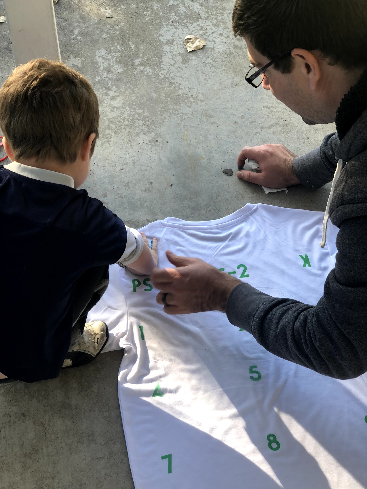 boy and father with shirt