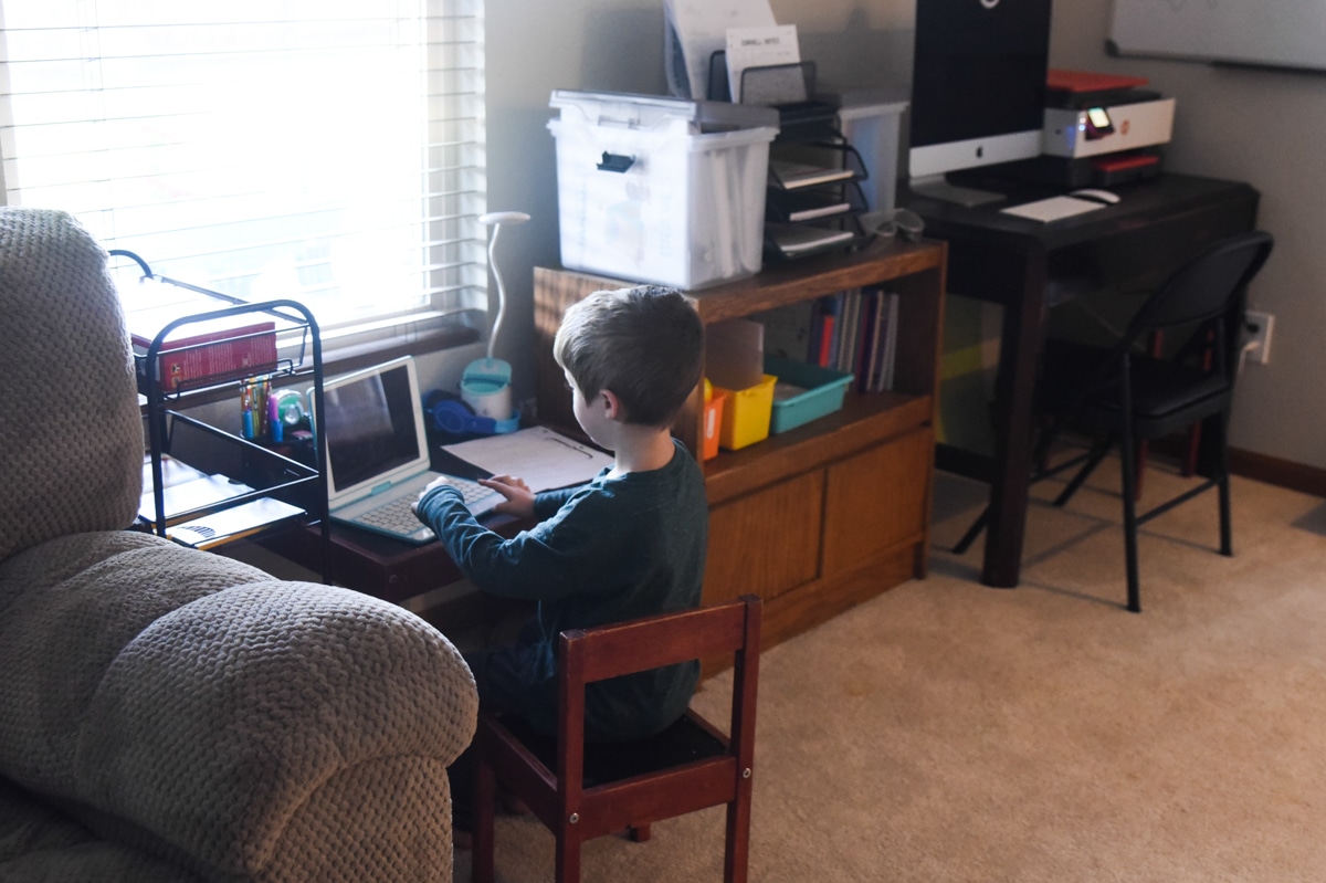 child sitting at desk